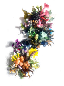 Brianna Barron, Celestial Amalgam, blown, fused, sculpted, assembled glass, wood, resin, found objects, 2023. 5 x 12 x 45”.
