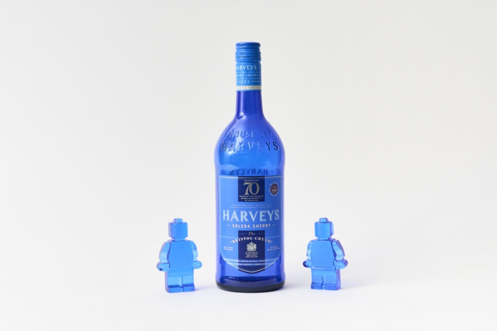 2 small blue glass figurines and a blue glass bottle