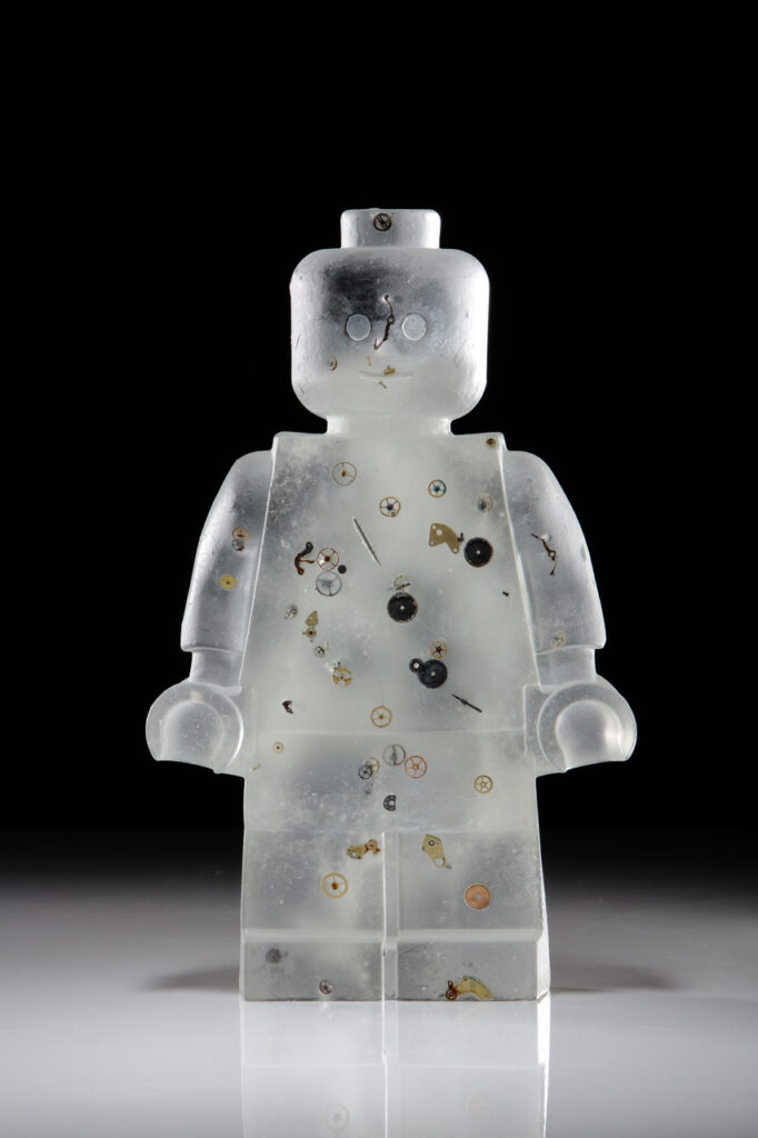 a cast glass figurine with screws embedded