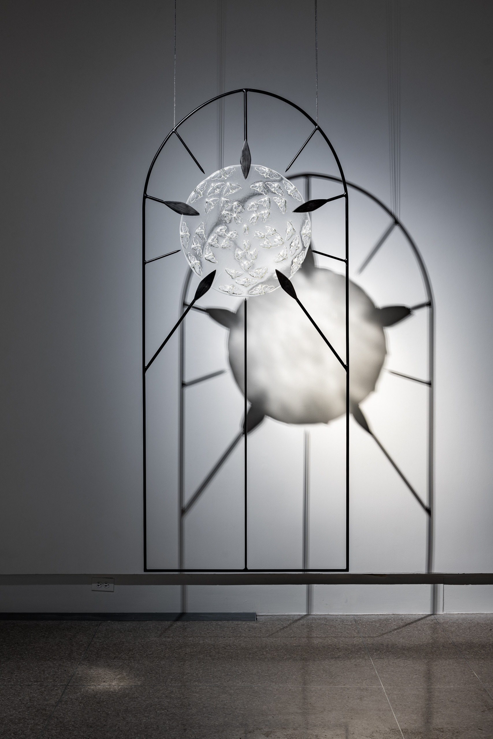 Liz Markum, Ascension (of Cicadas). Cast glass, steel, light. 85” x 36” x 2”, 2024. (Photo: Stephanie Gerhart)