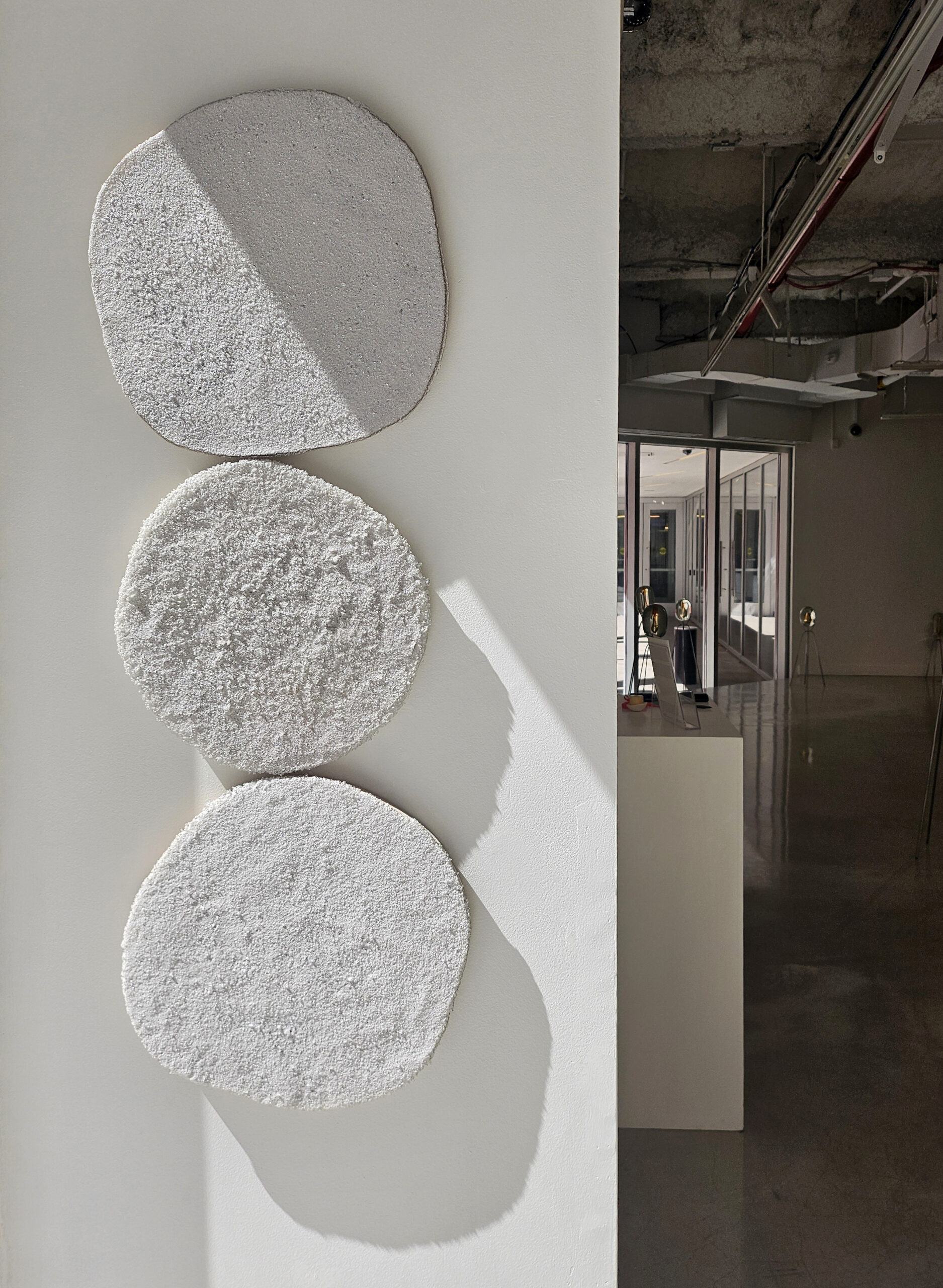 Jiemin Park, Installation view of “Ashes to Ashes” Exhibition. Fused glass powder on wood panel, 2024. (Photo: Artist).