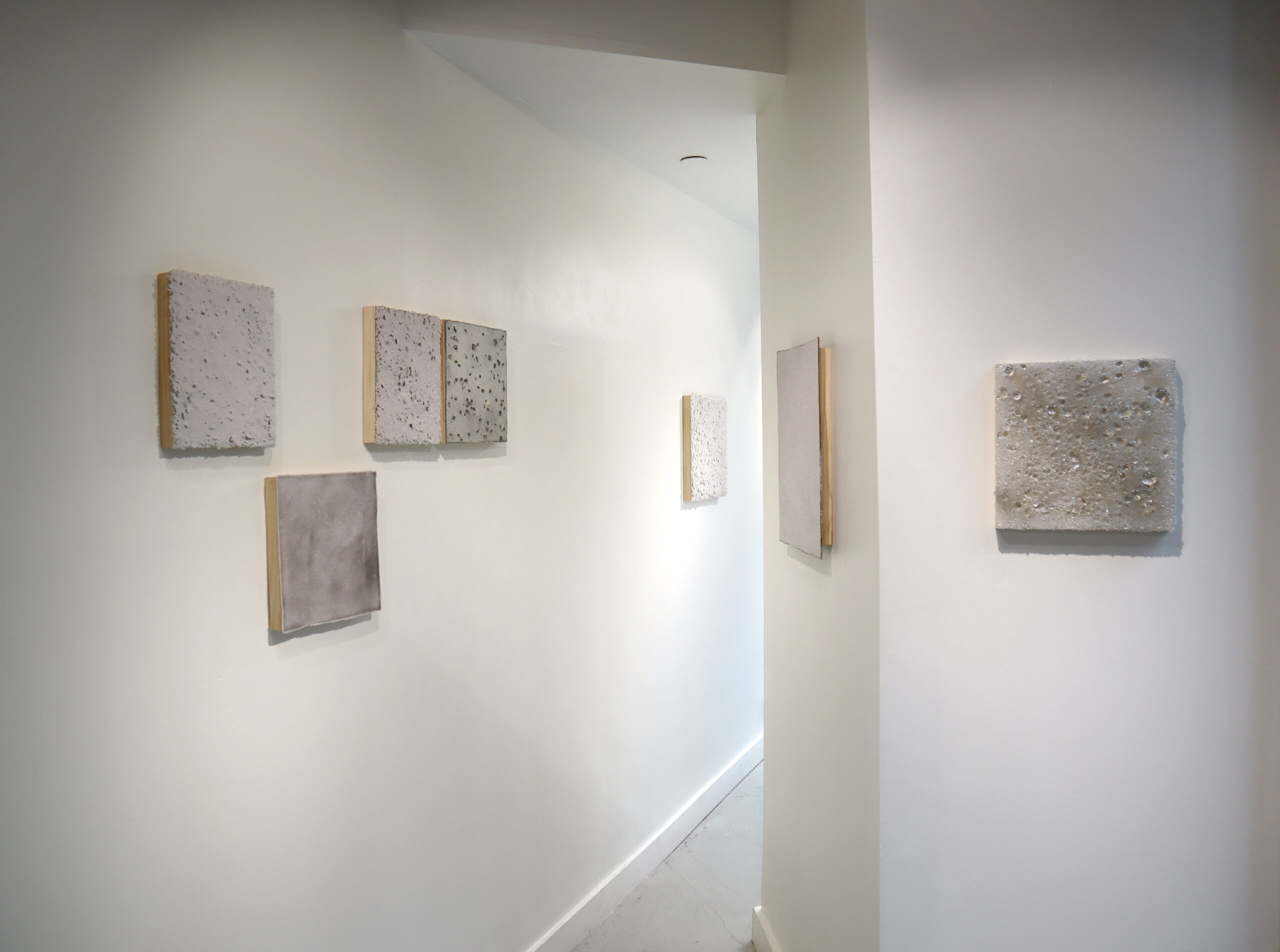 Jiemin Park, Installation view of “Ashes to Ashes” Exhibition. Fused glass powder on wood panel, 2024. (Photo: Artist).